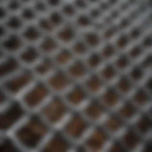 Close-up view of various galvanized wire mesh sizes used in farming applications